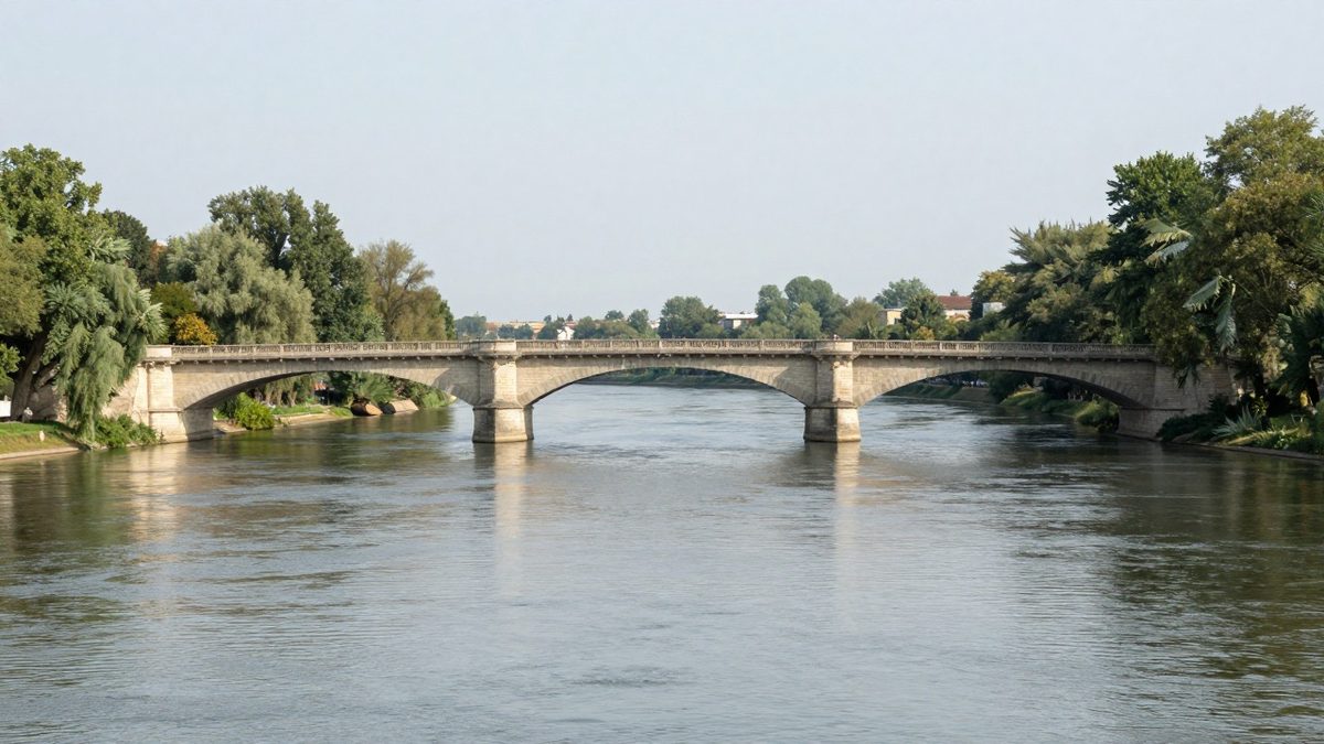 Illustration : un pont de pierre sur une rivière tranquille